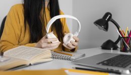 close-up-hands-holding-headphones