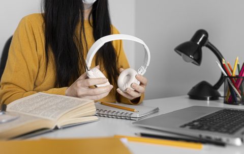 close-up-hands-holding-headphones